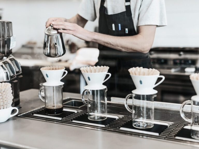 Person pouring coffee