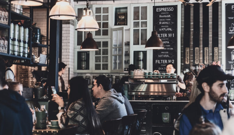 inside of a coffee house with lots of customers