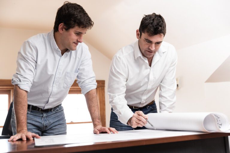 Two men talking at a table